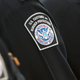 Illustration for article titled QAnon-Obsessed CBP Officer Arrested After Sending 'Numerous' Threats to Superior